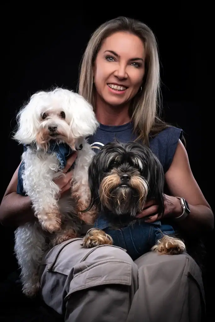 Woman photographed with her two dogs during a professional pet photography session in Johannesburg