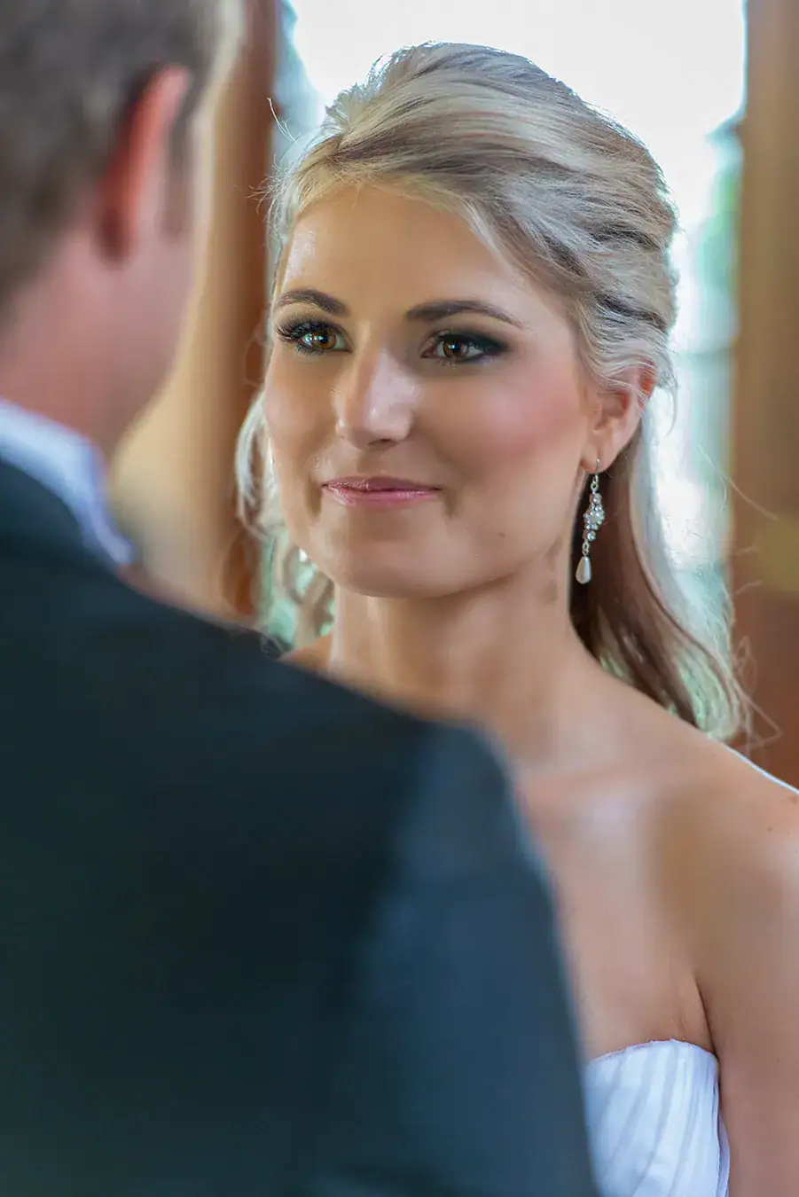 Bride sharing a quiet moment with the groom on their wedding day
