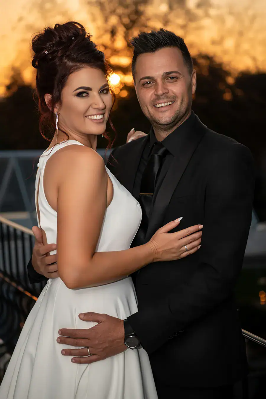 Bride and groom smiling together in a wedding portrait