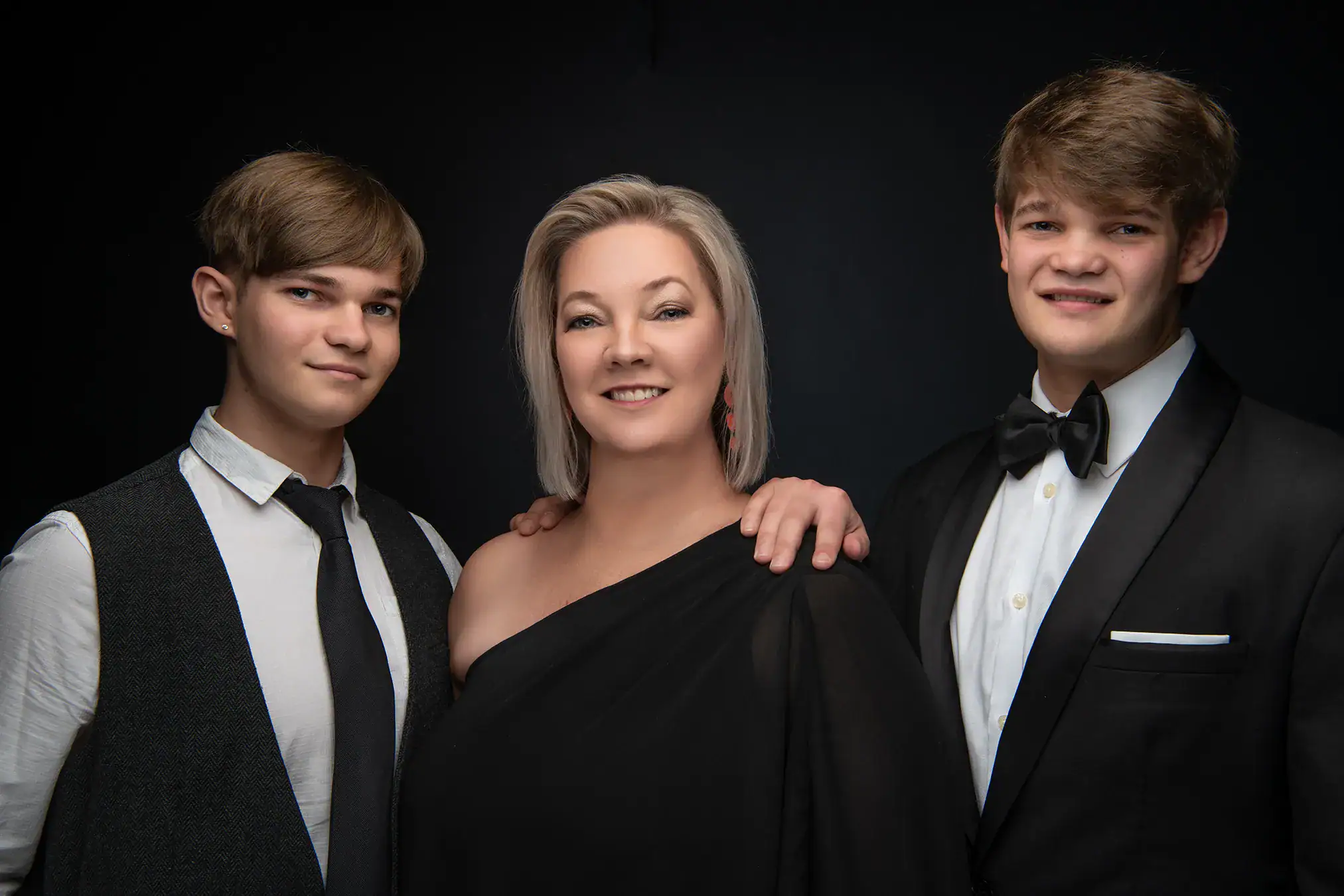Mother with two young men in formal matric farewell attire photographed together in a Johannesburg studio